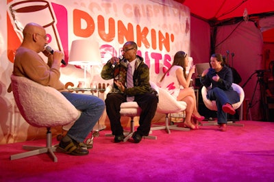 Armed with microphones, Julia Allison and Ahmed Ibrahim gave dating advice to consumers from the Dunkin' Donuts stage, which looked like a talk-show set.