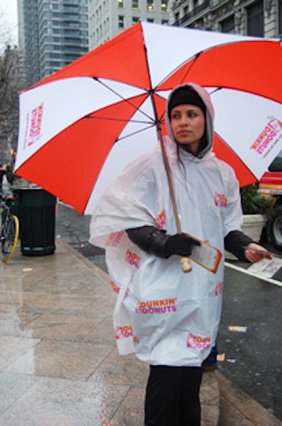 Street teams under Dunkin's Donuts-branded umbrellas handed out samples, coupons, and postcards advertising the day's events.