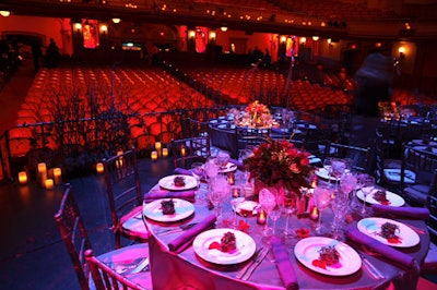 Covered in gray, military-inspired satin cloths and adorned with cinder-block centerpieces, the dinner tables sat on the stage of the Howard Gilman Opera House.