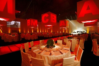 Light installations hanging from a temporary structure's ceiling featured the BCAM acronym.