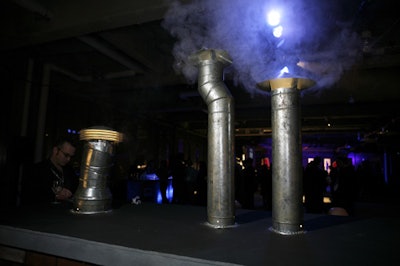 Smoking metal pipes supported the rooftop theme, providing unusual design elements and doubling as cocktail tables.