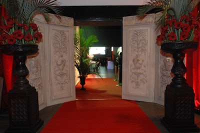 Plaster panels copied from original Italian architecture and floral arrangements from Forget Me Not Flowers created an elegant entrance to the venue.