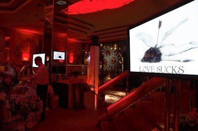 Throughout the New York Helmsley Hotel's anti-Valentine's Day ball, screens showed breakup-themed photos and images.