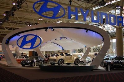 Looking to the future, Hyundai's curvaceous booth had a modern feel, and was covered in a transparent cloth canopy to let light in.