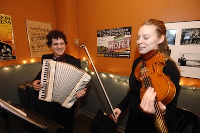An accordian player and violinist entertained guests prior to the performance.