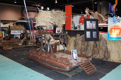 Water Spyder personal watercraft (floating devices used for hunting or extreme fishing) decked its booth with camouflage and reeds, for a rugged feel.