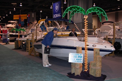 One Stop Boat Shop surrounded its area with docking poles and prop, electric-lit palm trees.