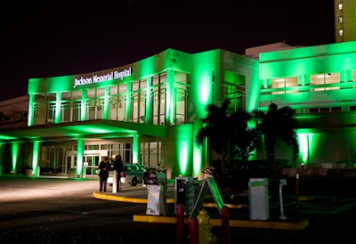 The exteriors of both the hospital entrance and event tent were lit a brilliant green, evocative of Oz's Emerald Palace at the end of the yellow brick road.