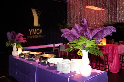 Buffet tables draped in purple linens offered guests Brazilian stews such as feijoada, made with beef, pork, and black beans.