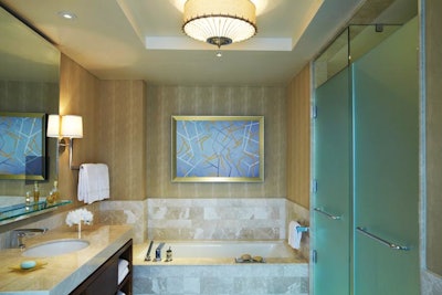 The 256 guest rooms all have marble countertops, bathtubs, and separate rain showers.
