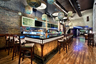 The first floor houses a glowing bar and a small lounge area. The cocktail list includes the Hibiscus Silk and an apple-pear saketini.