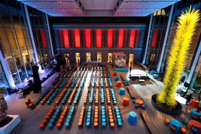 Haiti’s tropical climate played into the subtle decor, which included orange and teal linens and mahogany-colored chairs and silver candle holders from Be Our Guest.