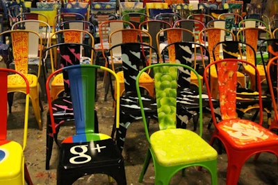 Guests sat in chairs designed by student artists and took them home after the event.