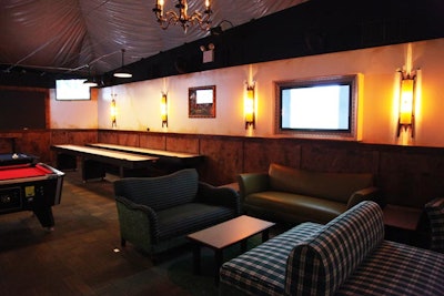 The rear of the main lounge area houses pool, shuffleboard, and air hockey tables.
