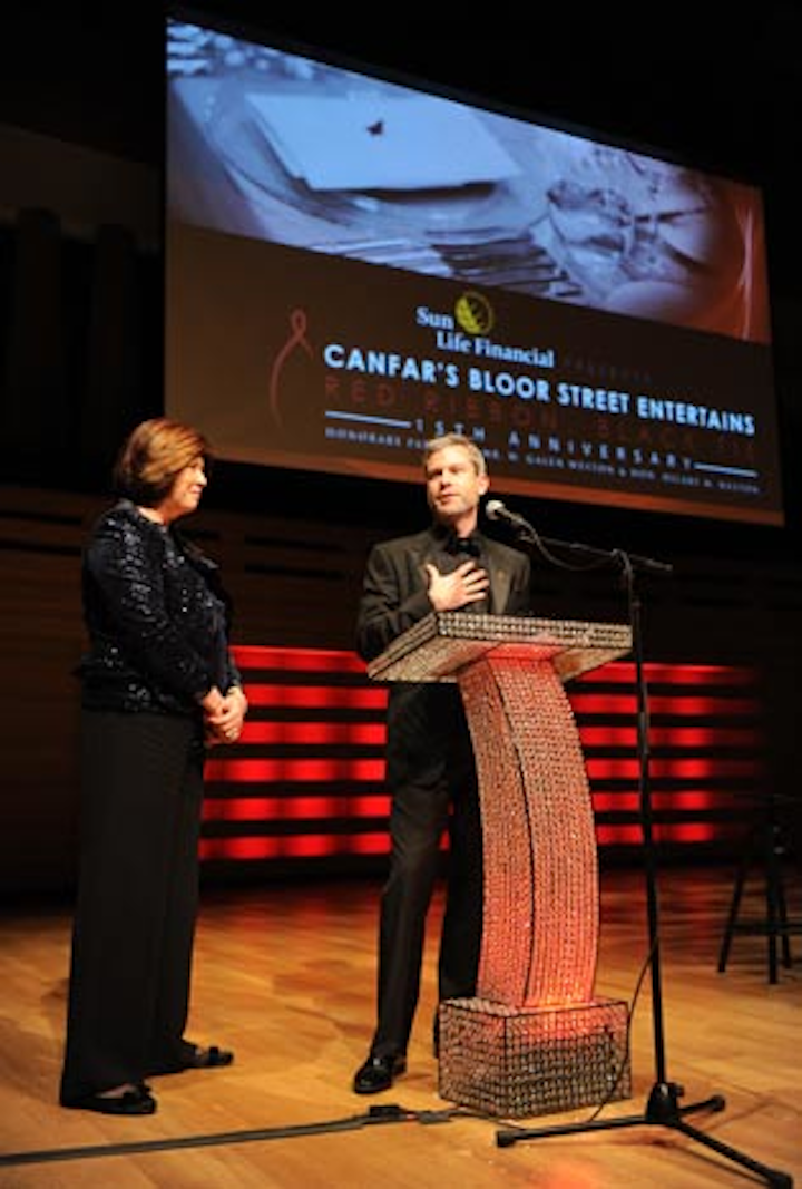 Gala chair Janice O'Born and gala co-chair Tristan Michela spoke on stage during The Show. The podium was made out of crystals and lit from below.