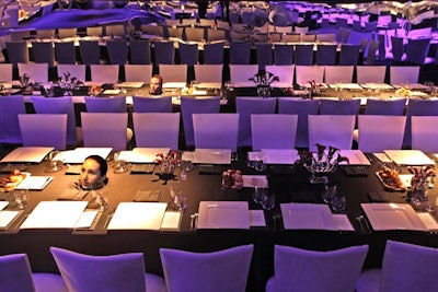 The heads of performance artists protruded through dinner tables.