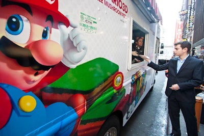 Parked on 44th Street, the 'Mushroom Kingdom' pizza truck gave out free slices of mushroom pizza to those who tweeted using the #SuperMario3D hashtag.