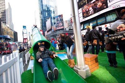 A green tubular slide was designed to imitate the game's 'warp pipes' and included sound effects and music.