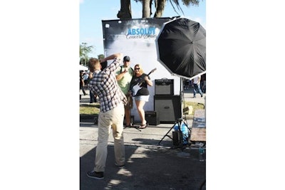 Attendees could hold props such as a guitar for instant photos offered by Absolut.