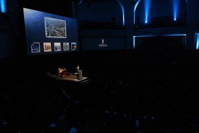 University of Toronto president David Naylor spoke during the Boundless presentation in Convocation Hall. Images from the campaign were projected onto one large screen and two smaller screens on either side.