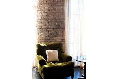 On the third floor, casement windows open to Pearl Street.