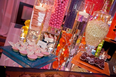 The hotel served the dessert buffet options on brightly colored glass trays on each side of the tables.