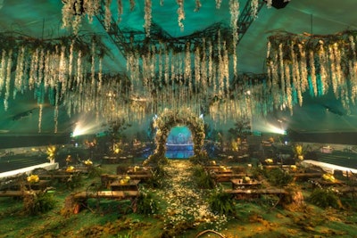 A dramatic floral canopy and wedding arch in the center of the party space evoked the wedding scenes in the film.