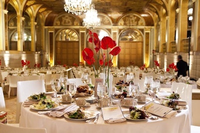 For the Oracle-hosted luncheon on Monday, vases of red anthuriums contrasted with the simple white accents.
