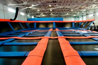 The venue has a patented trampoline court that allows co-workers to bounce in tandem.