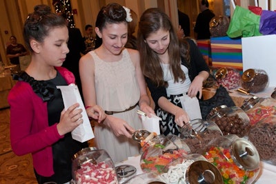 A candy bar let guests fill paper bags with old-fashioned sweets.