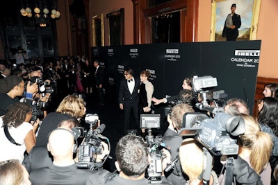 An all-black carpet and step-and-repeat backdrop was placed in the area beyond coat check. Guests, including Julianne Moore and photographer Mario Sorrenti, posed in this space for the gathered photographers.