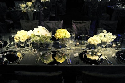 Gray-hued raw silk was used throughout the dinner venue, with three shades of the color on the tablecloths and five distinct tints for the chair covers. In contrast, a nearly all-white color palette was employed for the table settings, which incorporated everything from French tulips, paper whites, peonies, and hyacinth to tuberoses, gardenias, and carnations.