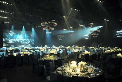 The dinner and after-party used 22,338 square feet of the Drill Hall, allowing the 900 attendees plenty of room to move. Tables, in both circular and rectangular forms, were placed symmetrically to allow optimal views of the stage.