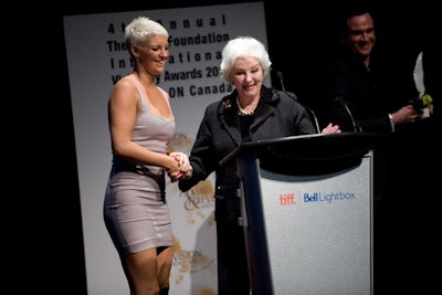 Elizabeth Grant (right) awarded Sammie Kennedy with the Elizabeth Grant Entrepreneur Award for her work as creator and C.E.O. of Booty Camp Fitness.