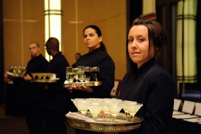 Servers carried trays of martinis with olives and trays of lemon drop martinis.