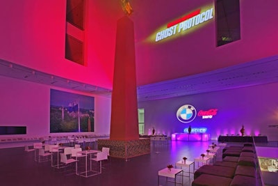 Projections of the film's title stood above lounge seating at the after-party.