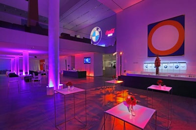 Purple and amber uplighting added color to the museum's all-white walls.