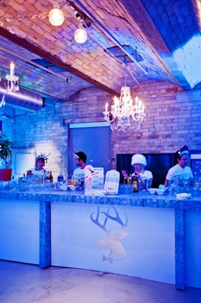 A reindeer decal, a riff off of the Playboy bunny, decorated the bar. The room was lit in blue and decorated with hanging chandeliers and a fake fireplace.