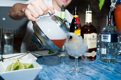 Martini Club International created cocktails for the event, which included the Naughty N' Ice, with gin or vodka, Aperol, Earl Grey tea, and grapefruit juice, poured over dry ice in a teapot.