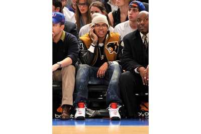 Chris Brown with Allstar's director of executive protection at a 2010 Knicks game.