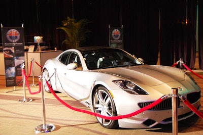 A Fisker Karma electric car was on display at the back of the dining room.