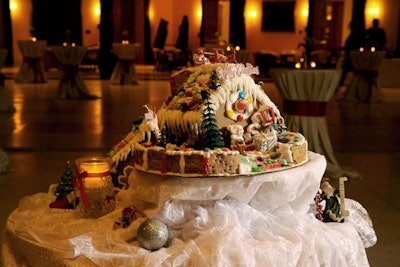 Delicious Gourmet adorned the buffet table with a gingerbread house display.