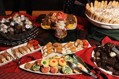 The dessert buffet included a variety of Italian sweet treats like cannoli, tiramisu with lady fingers, chocolates, and Christmas cookies.
