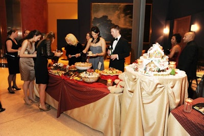 Delicious Gourmet provided gold and red lines for the buffet and hightop tables surrounding the dance floor.