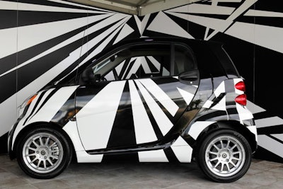 A Smart car featured art titled, 'Razzle Dazzle,' by Damon Martin.