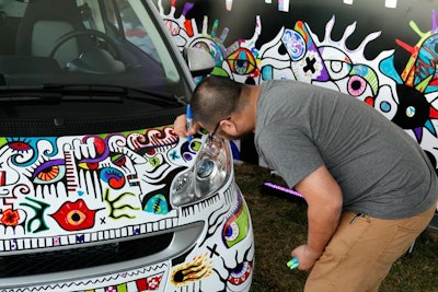 Visitors used Sharpies to add to the works of art, part of a community art project.