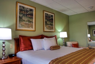 Refreshed guest rooms have complimentary Wi-Fi and an earthy color palette.