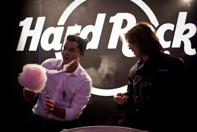 At a Hard Rock-branded cart, male waitstaff made cotton candy for guests.
