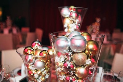 Gold and silver ornaments and candy acted as centrepieces in the dining room. Each table could participate in a silent auction, and the highest bidders took home the centrepieces.