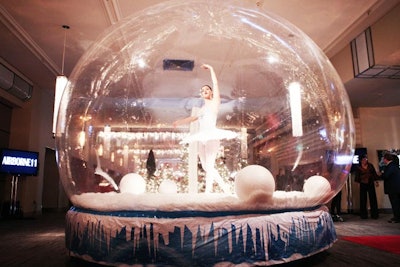 In the reception space, guests were greeted by a ballerina dancing in a blow-up snow globe.